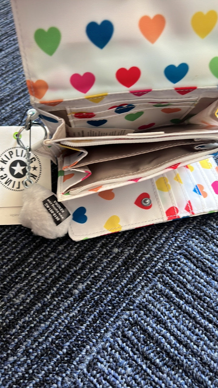 Kipling Pixi AC3739 Medium Organizer Wallet in Wild Hearts White, nylon material, with 8 card slots, bill pocket, zip divider, back slip pocket, and detachable monkey keychain, approx. 7.5" × 4.25" × 1.25".