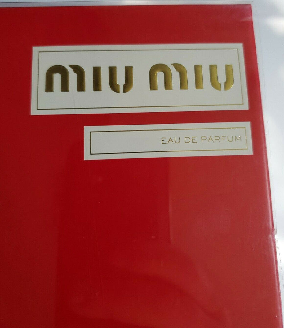 Miu Miu perfume and body lotion gift set with quilted turquoise bottle design and red packaging