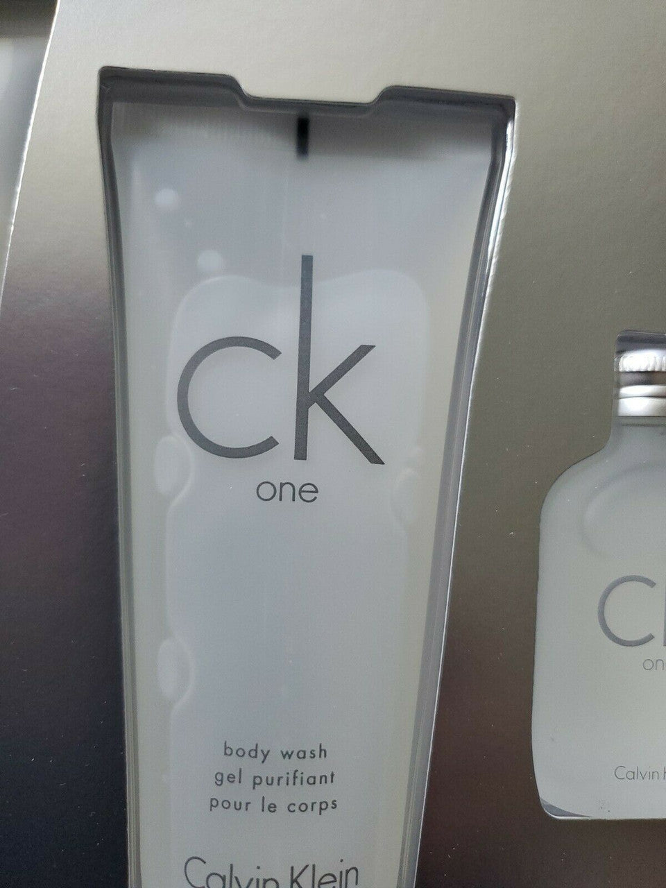4-piece CK ONE gift set with full-size EDT spray, mini, lotion, and body wash in Calvin Klein gift box