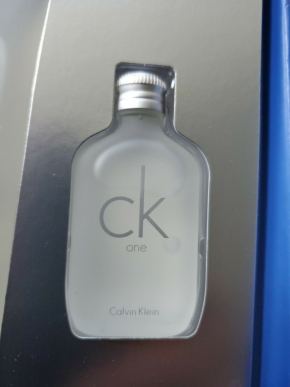4-piece CK ONE gift set with full-size EDT spray, mini, lotion, and body wash in Calvin Klein gift box