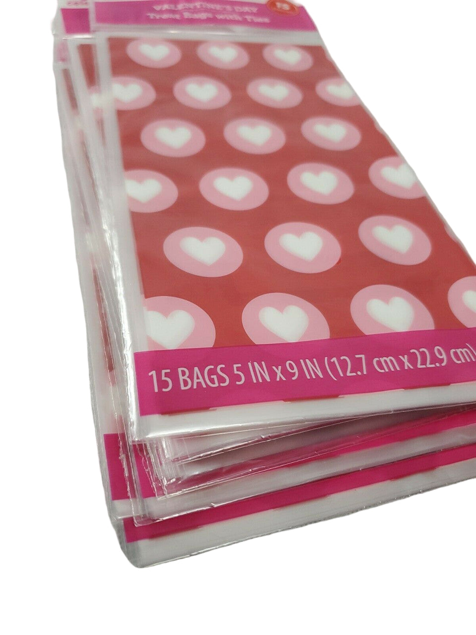 Red Valentine’s Day treat bags with white hearts, twelve retail packs with fifteen bags each and matching twist ties.
