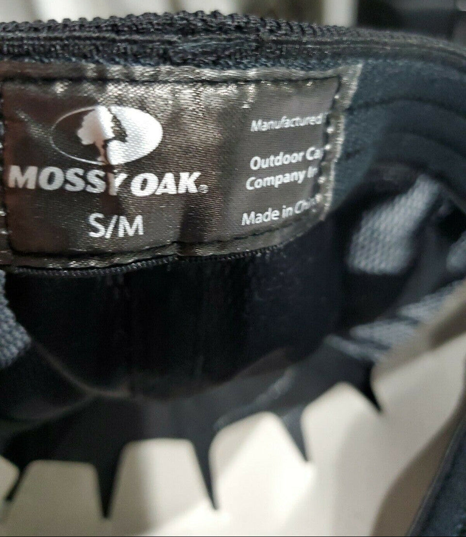 Mossy Oak men's black camo baseball cap with stretch-fit Proflex band and plastic mesh back, displayed from multiple angles.