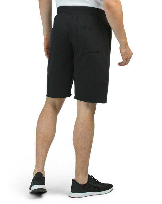 Black fleece cut-off shorts with Champion embroidered logo, raw hem, and side pockets
