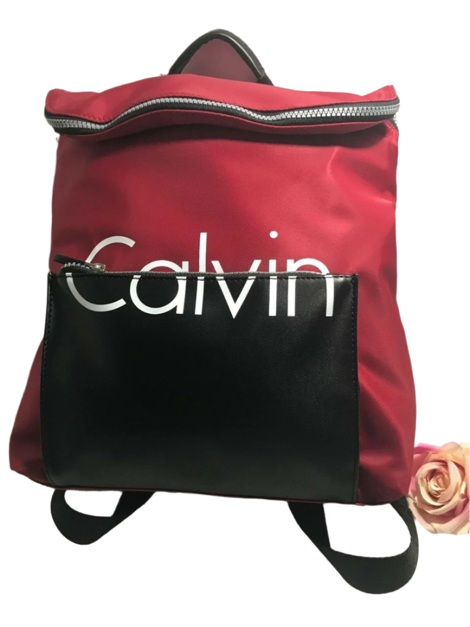 Red and black Calvin Klein backpack with large front logo, flap closure, and adjustable straps