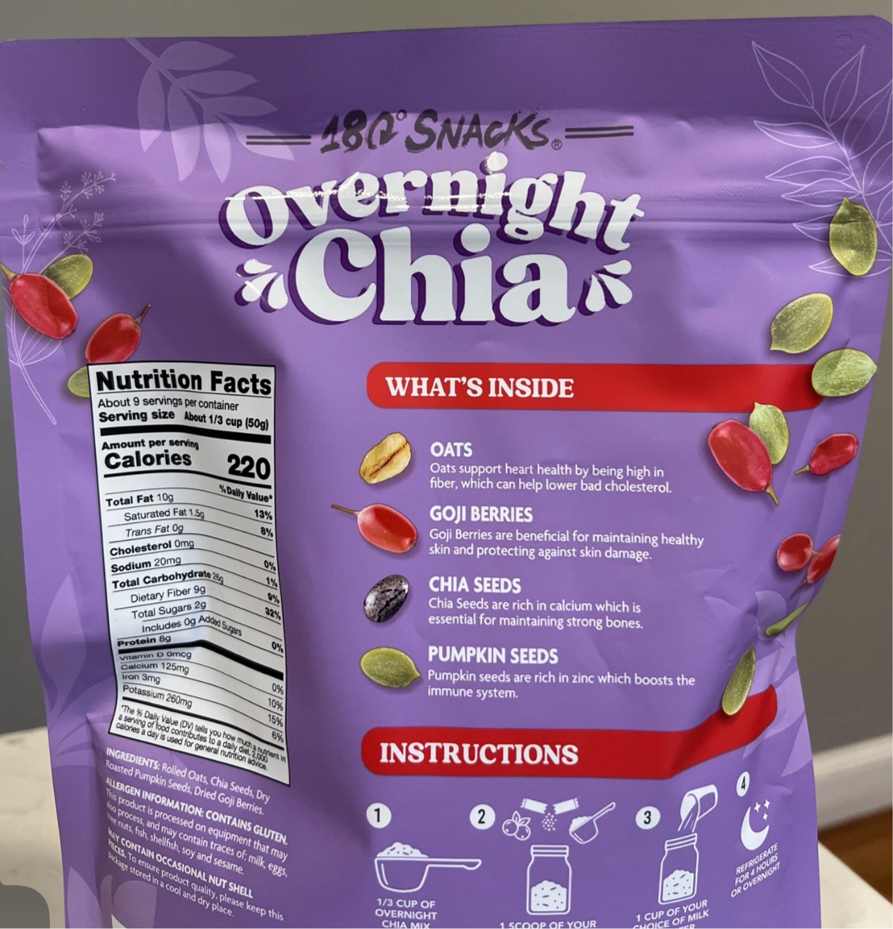 Overnight chia mix with oats, chia seeds, goji berries, and pumpkin seeds in purple resealable pouch