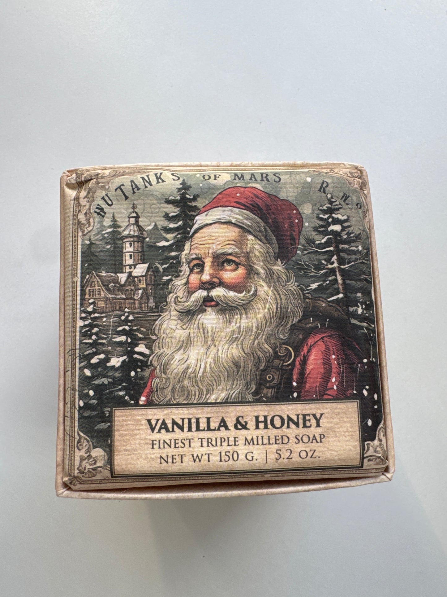 Three-bar soap gift set with vintage-style holiday packaging, tied with red ribbon, scented in vanilla and honey.