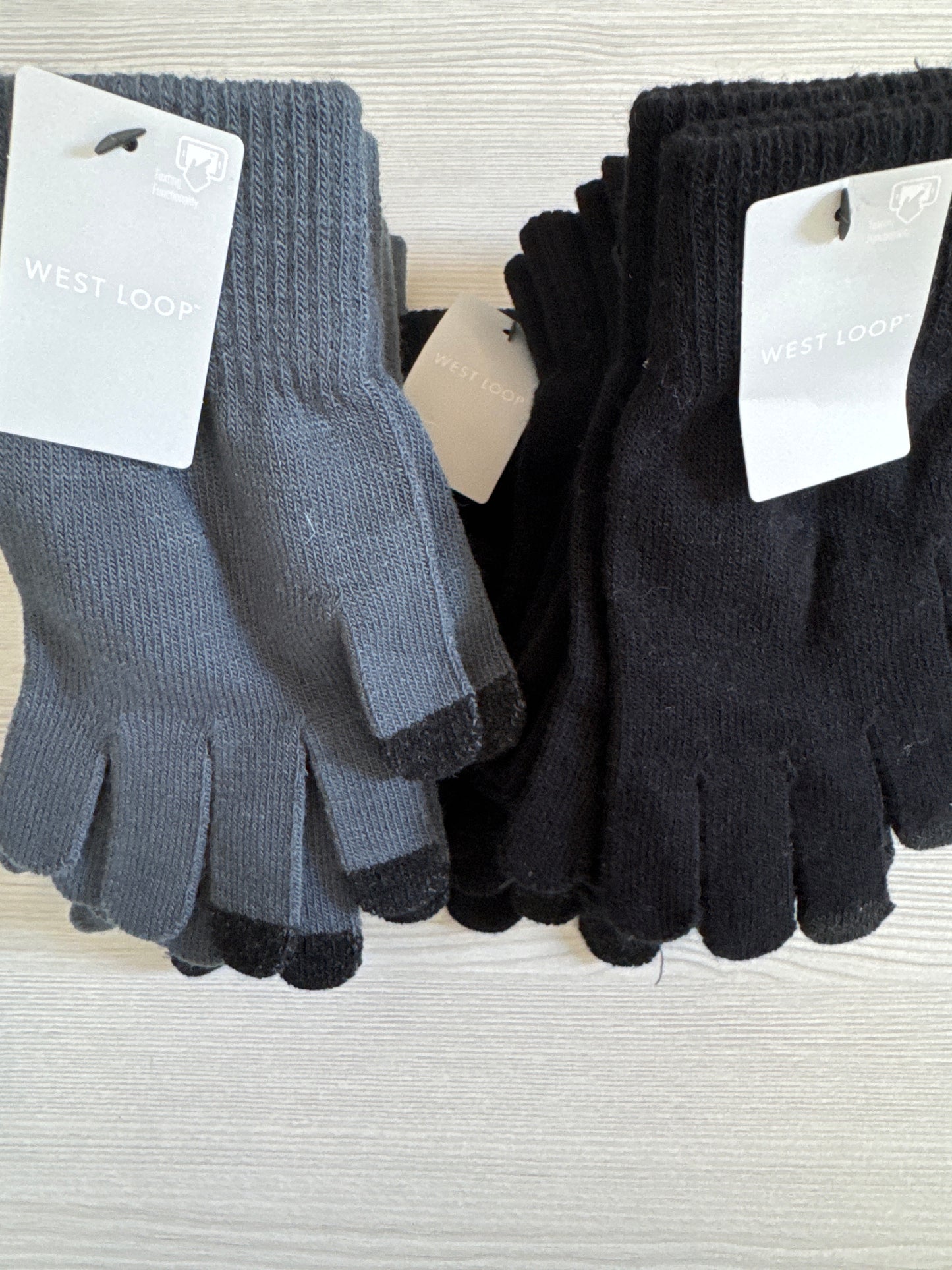 Two pairs of West Loop touchscreen gloves in gray and black, one-size knit style with touch-capable fingertips