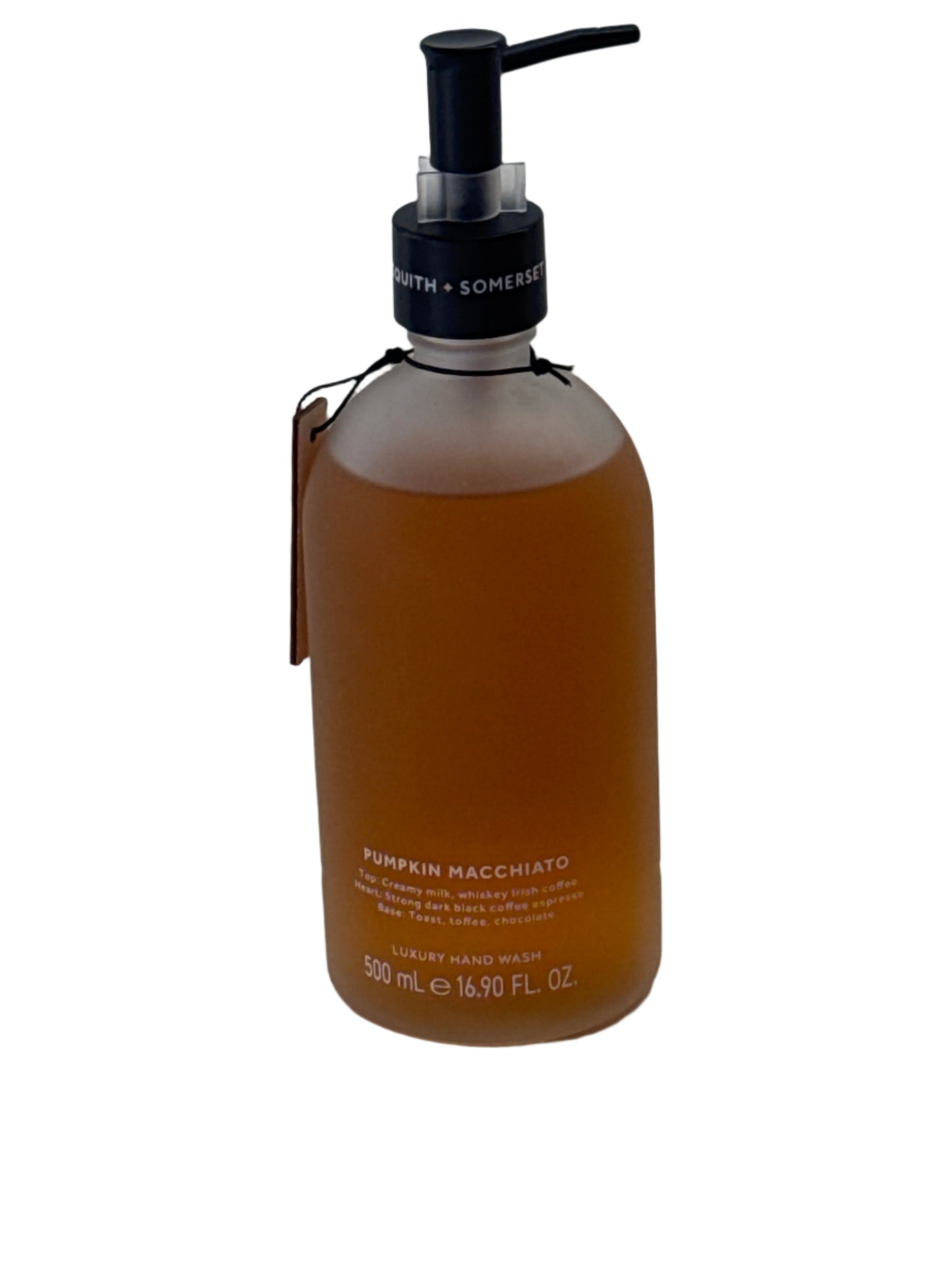 Elegant frosted glass bottle of fall-scented Pumpkin Macchiato hand soap with black pump dispenser, placed next to seasonal décor.