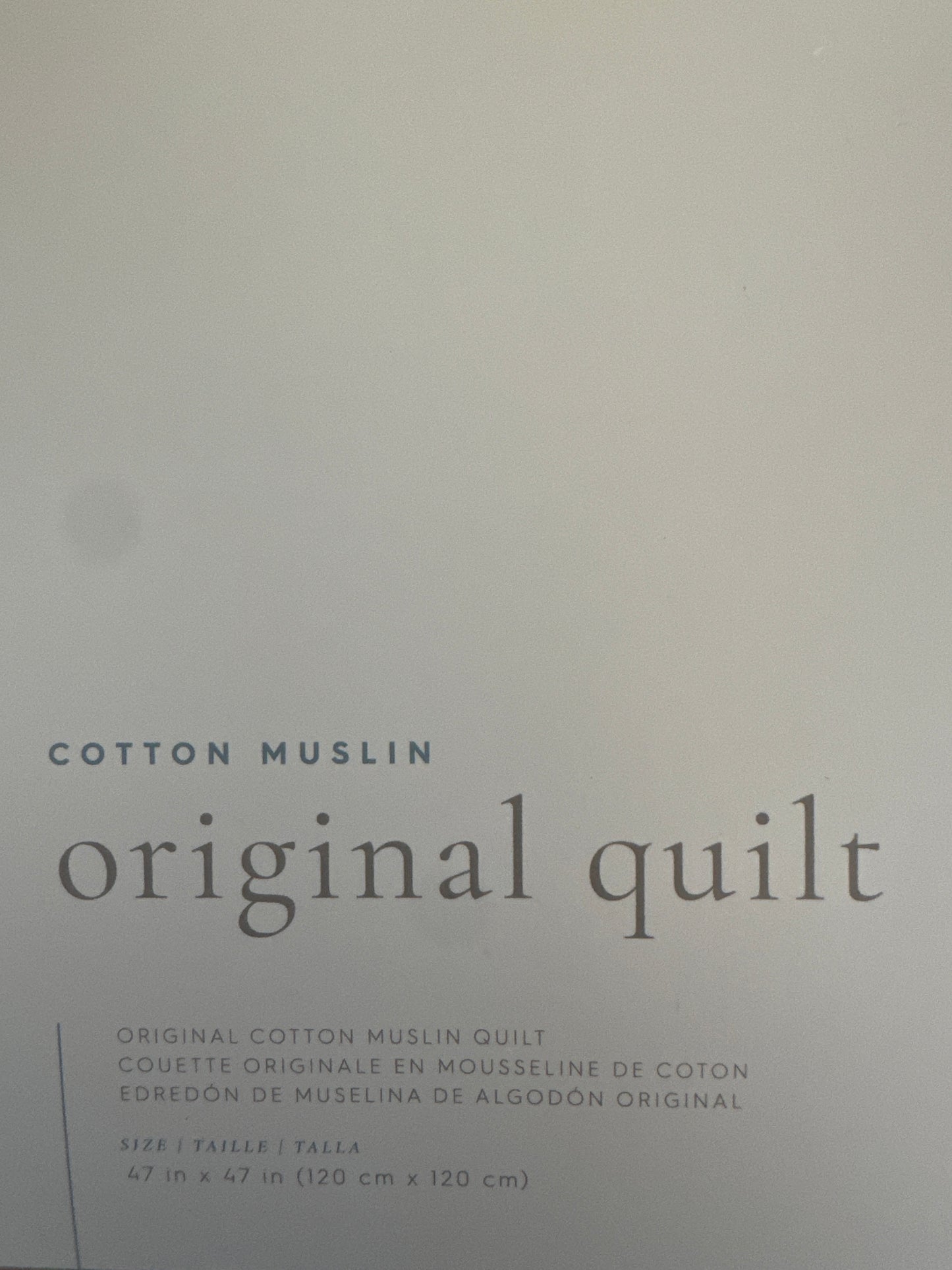 Powder Party Original Cotton Muslin Quilt by Little Unicorn with playful design and soft texture.