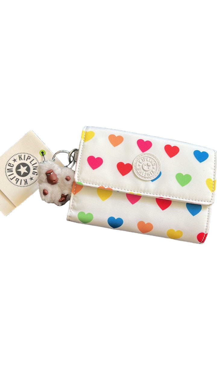 Kipling Pixi AC3739 Medium Organizer Wallet in Wild Hearts White, nylon material, with 8 card slots, bill pocket, zip divider, back slip pocket, and detachable monkey keychain, approx. 7.5" × 4.25" × 1.25".