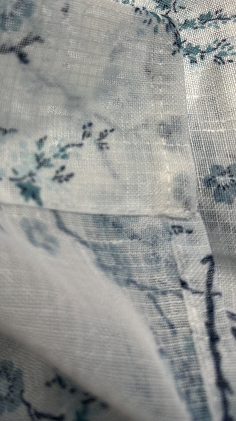 Pair of 38x84 sheer floral curtain panels in soft blue blossom print by Laura Ashley