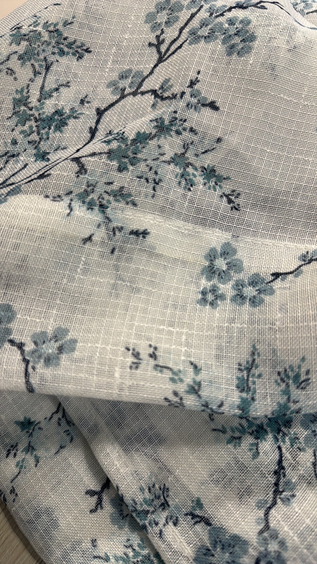 Pair of 38x84 sheer floral curtain panels in soft blue blossom print by Laura Ashley