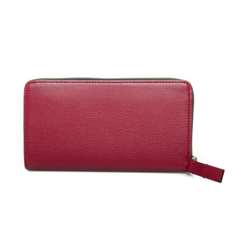 Calvin Klein Red Rock zip-around wristlet wallet with pebble-textured synthetic leather, metal logo on front, and organized interior with multiple card slots and compartments.