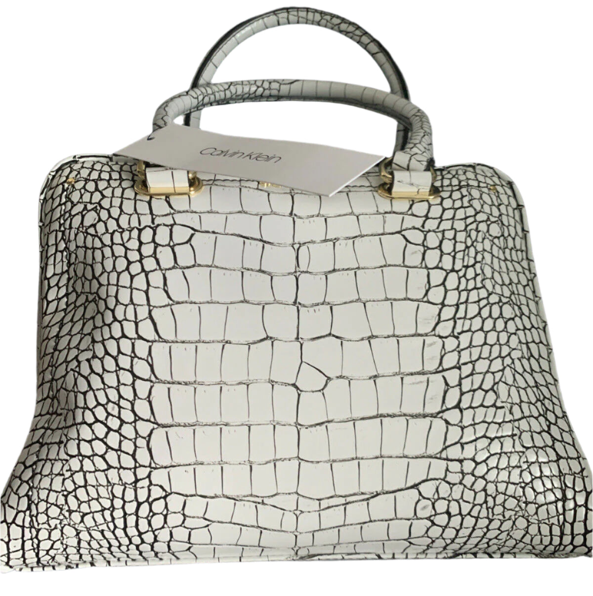 Calvin Klein white crocodile leather handbag with gold accents, adjustable crossbody strap, and black interior with multiple pockets.