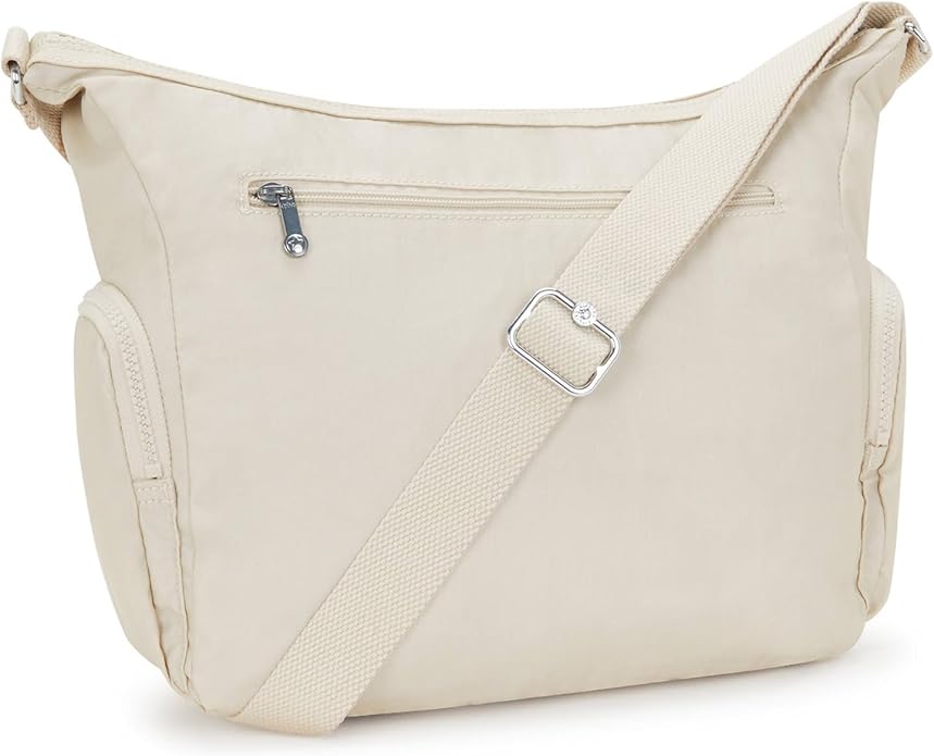 Lightweight cream nylon crossbody shoulder bag with multiple zipper pockets, adjustable strap, and plush monkey keychain – size 11.5" x 8.75" x 6.5"