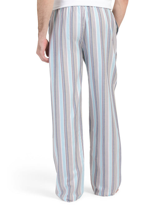 Hanro men's woven lounge pants with blue and neutral stripe print, shown full length with smocked drawstring waistband.