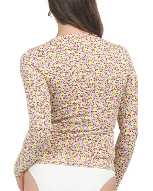 Long sleeve floral rashguard top in pink and yellow print, size Medium