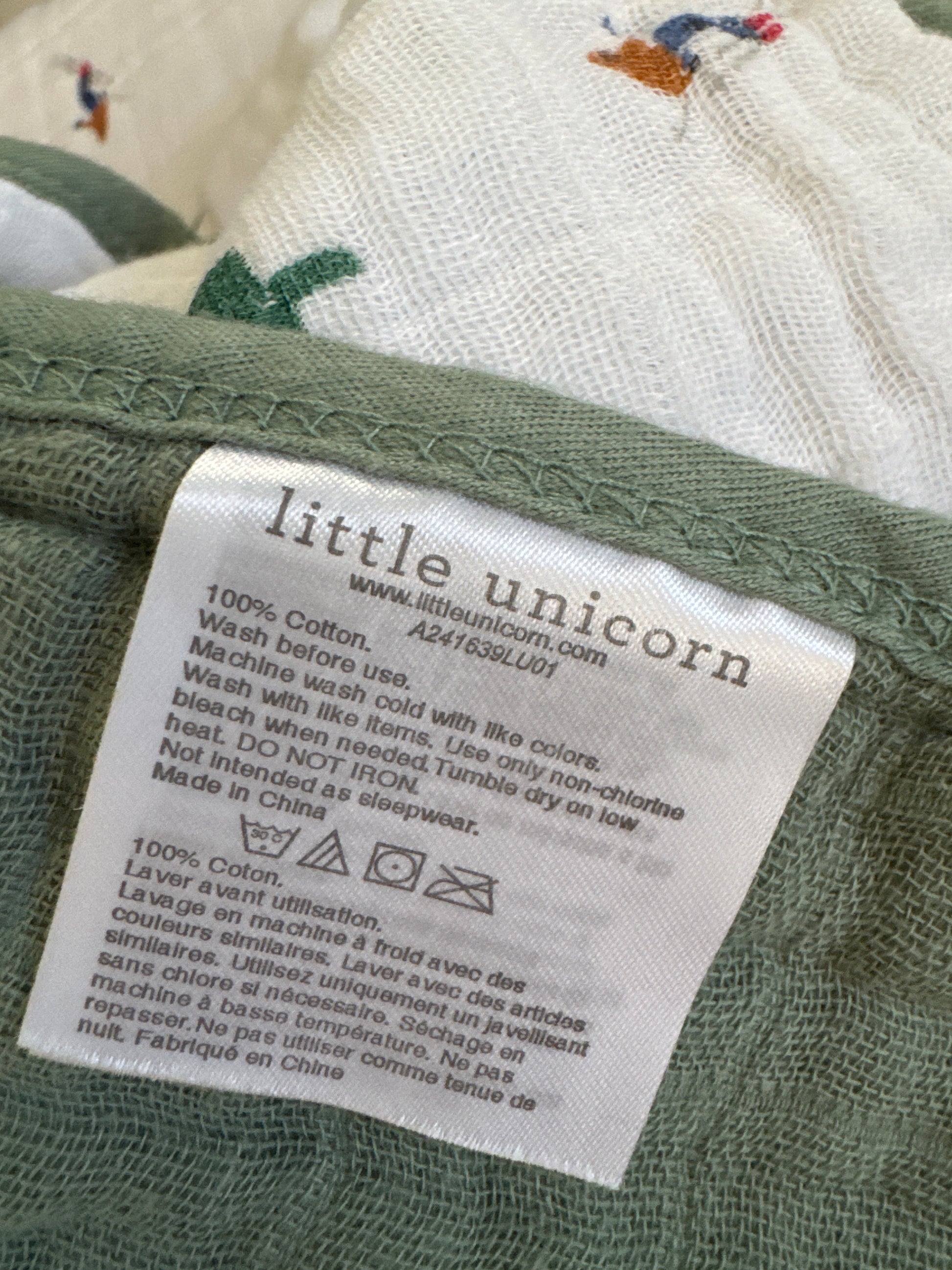 Powder Party Original Cotton Muslin Quilt by Little Unicorn with playful design and soft texture.