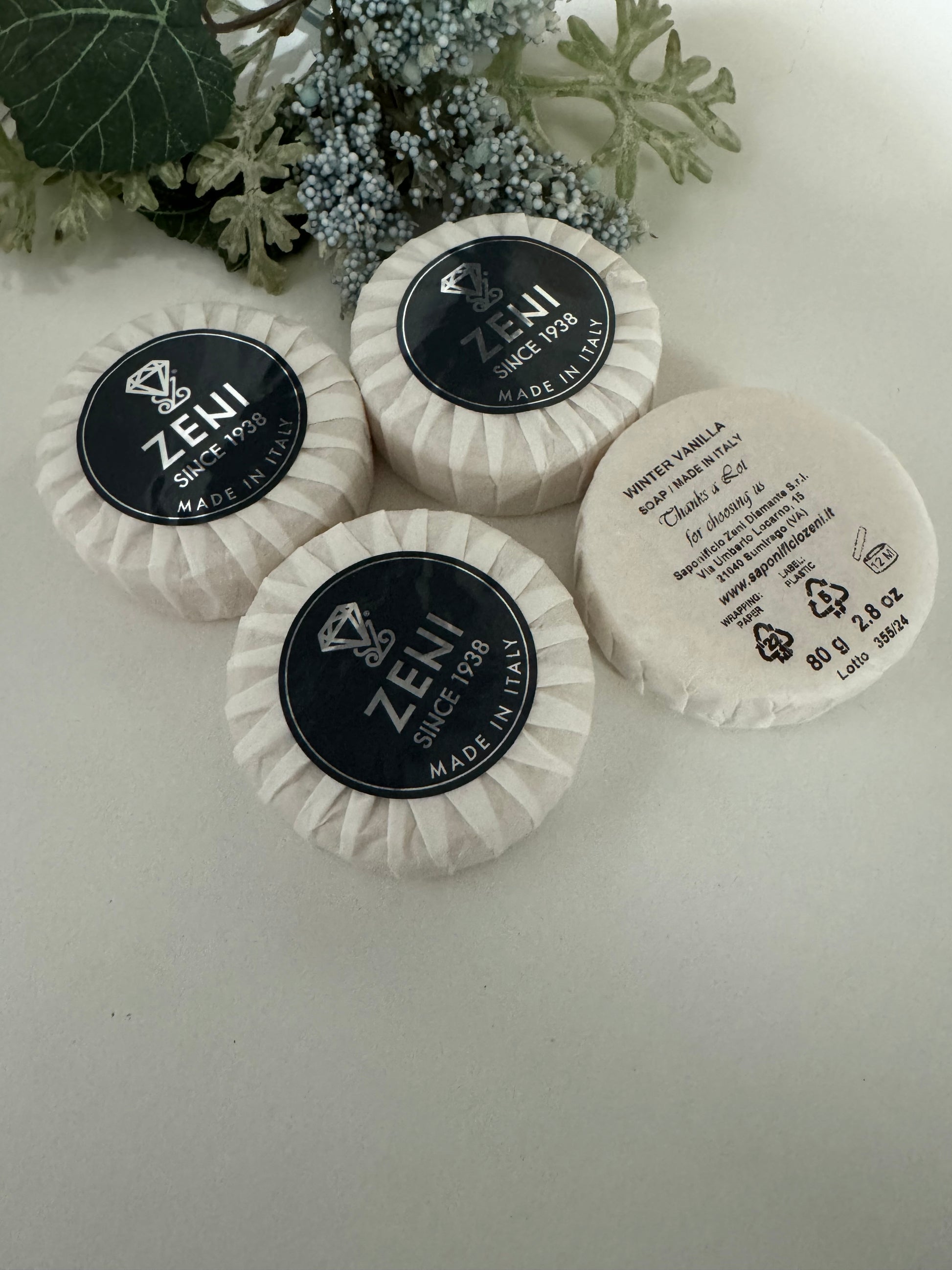 Set of Winter Vanilla scented round soap bars displayed with light seasonal decor, ideal for gifting