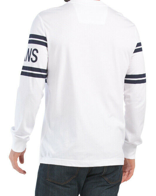 Calvin Klein Jeans white varsity logo long sleeve crew neck tee with ribbed collar and cuffs, featuring bold navy logo across chest and sleeves