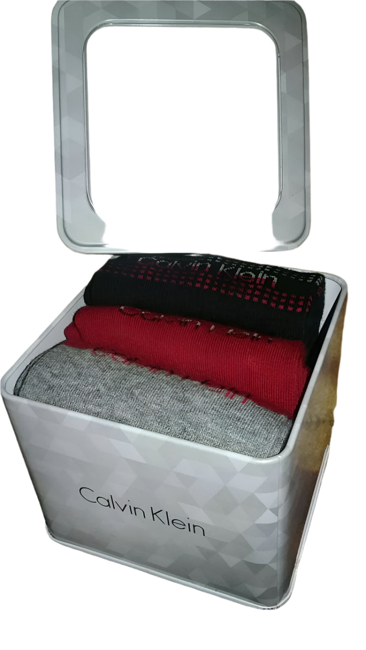 Calvin Klein women’s crew socks, 3 pairs in assorted colors, displayed in a silver-tone metal gift box with clear lid.