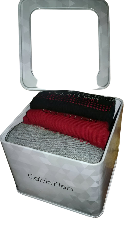 Calvin Klein women’s crew socks, 3 pairs in assorted colors, displayed in a silver-tone metal gift box with clear lid.