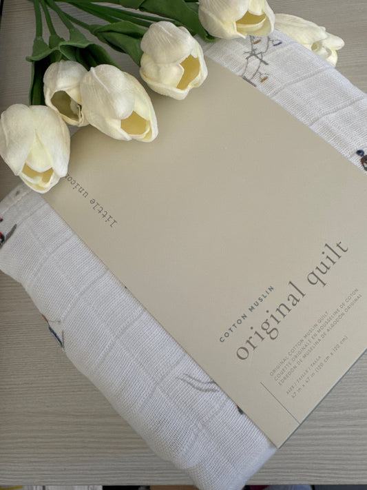 Powder Party Original Cotton Muslin Quilt by Little Unicorn with playful design and soft texture.