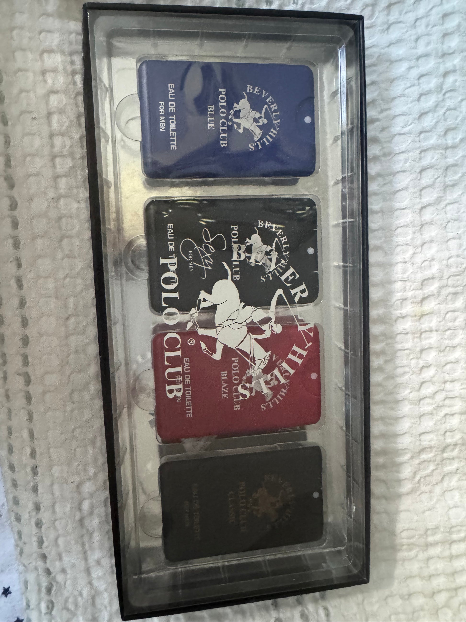 Beverly Hills Polo Club 4-piece men’s eau de toilette gift set with Blue, Sexy, Blaze, and Classic scents in rectangular tins