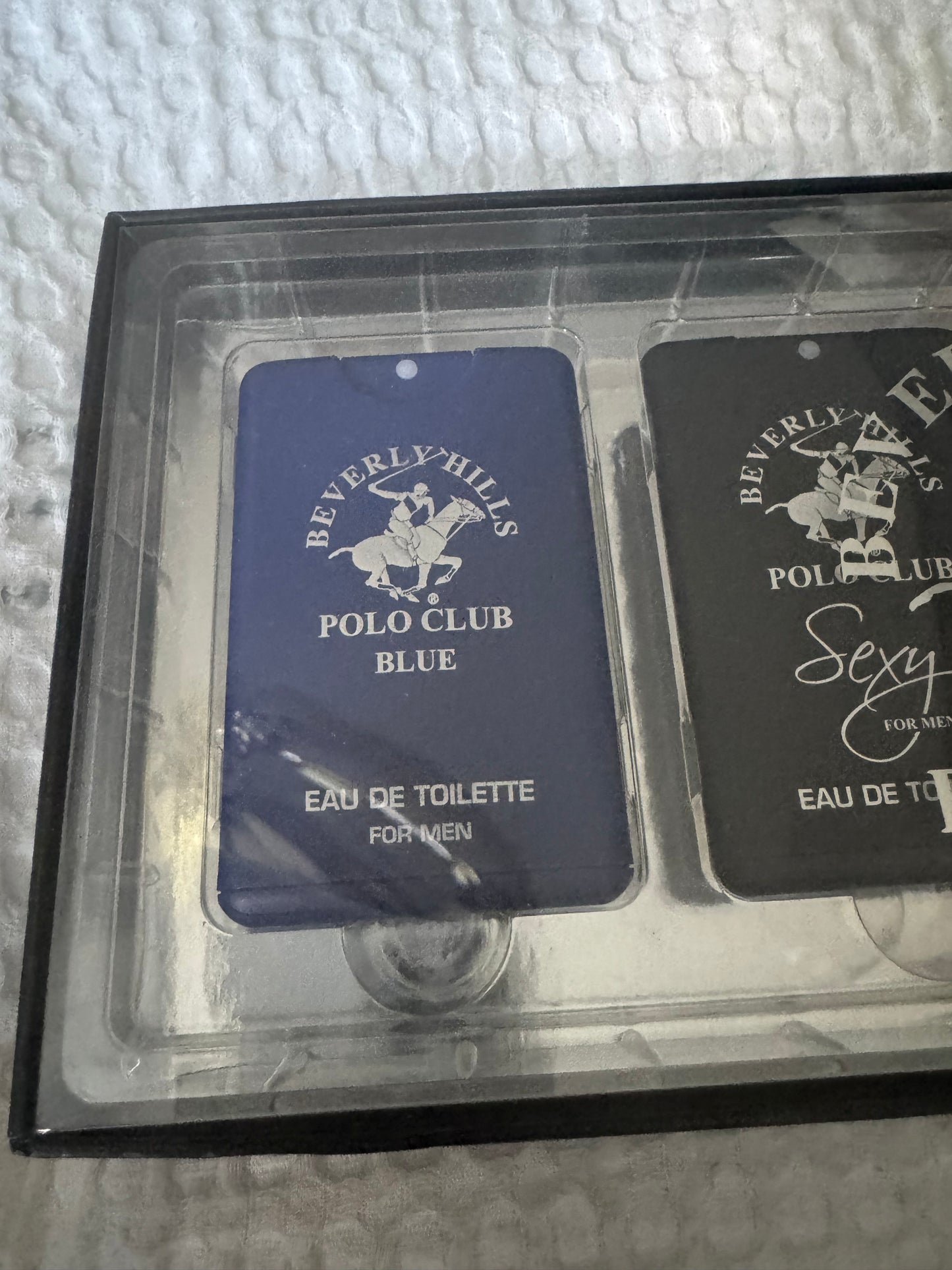 Beverly Hills Polo Club 4-piece men’s eau de toilette gift set with Blue, Sexy, Blaze, and Classic scents in rectangular tins