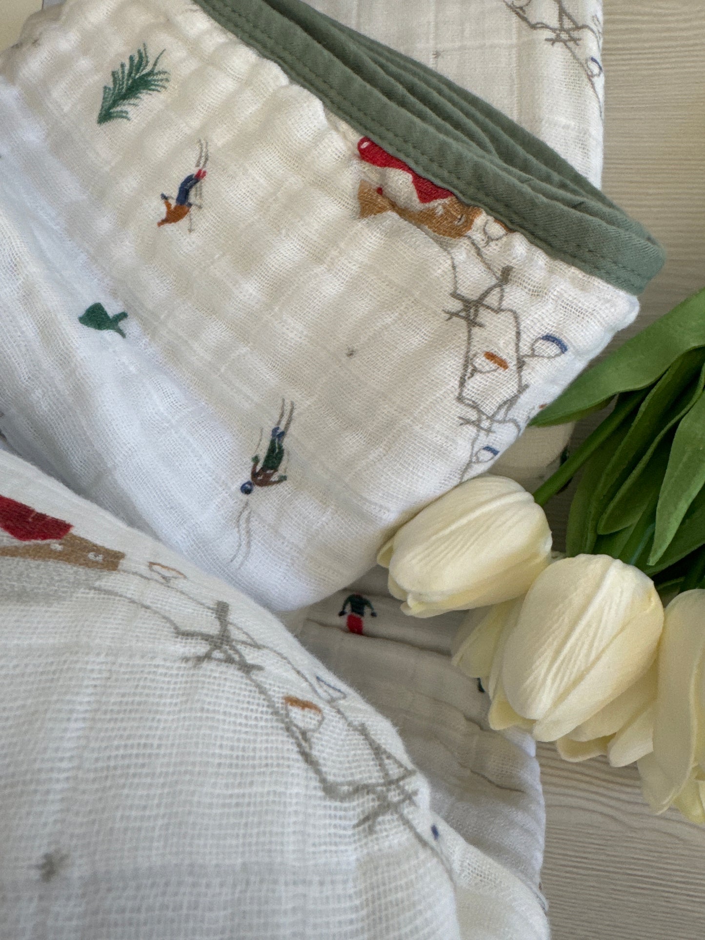 Powder Party Original Cotton Muslin Quilt by Little Unicorn with playful design and soft texture.