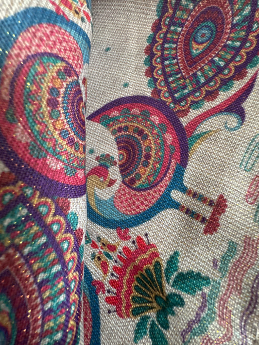 Close-up of a set of 8 vibrant, peacock-themed napkins with intricate lurex and printed designs. Each napkin is elegantly crafted from polyester with metallic fibers, showcasing a festive and luxurious touch with a rich color palette