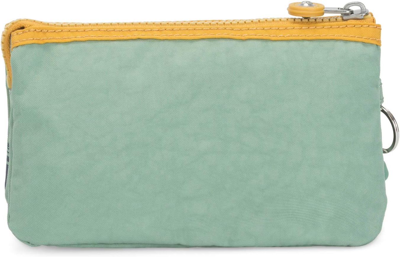 Kipling Creativity Pouch in Rio Palm print with bright yellow trim, triple zip compartments, compact 7.25″ × 4.25″ × 0.5″ size, perfect for travel and everyday use.