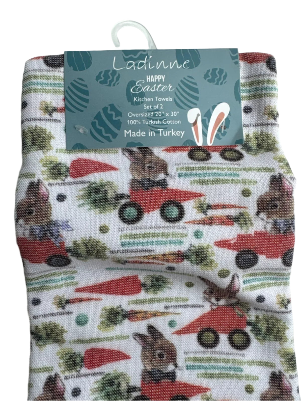 Pair of Easter-themed oversized kitchen towels with bunny and red truck design on white background.
